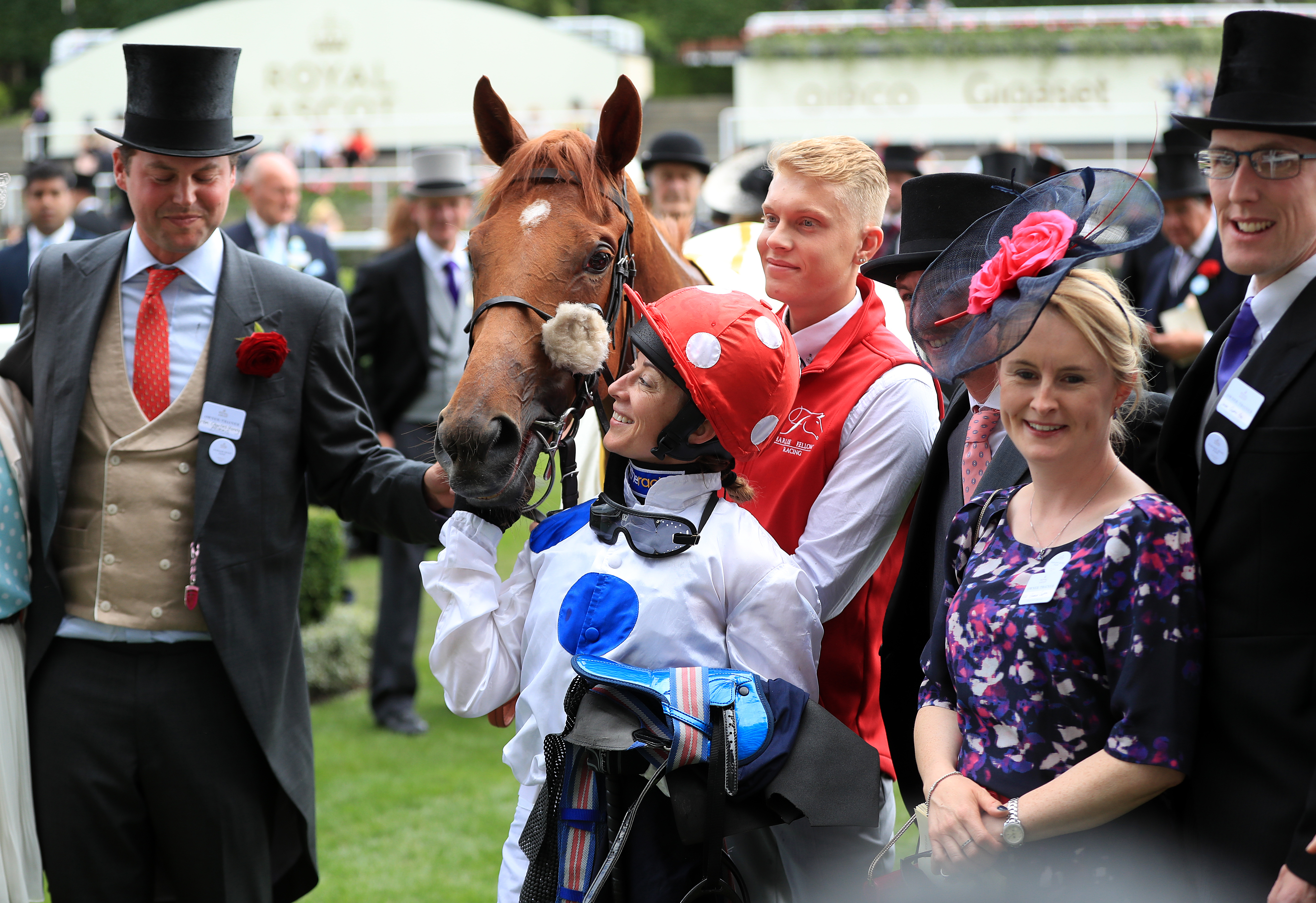 Hayley Turner poses with horse Thanks Be and trainer Charlie Fellowes (left)