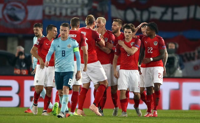 Austria’s Marko Arnautovic (centre) celebrates