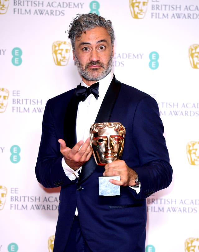 Taika Waititi with the award for best adapted screenplay 