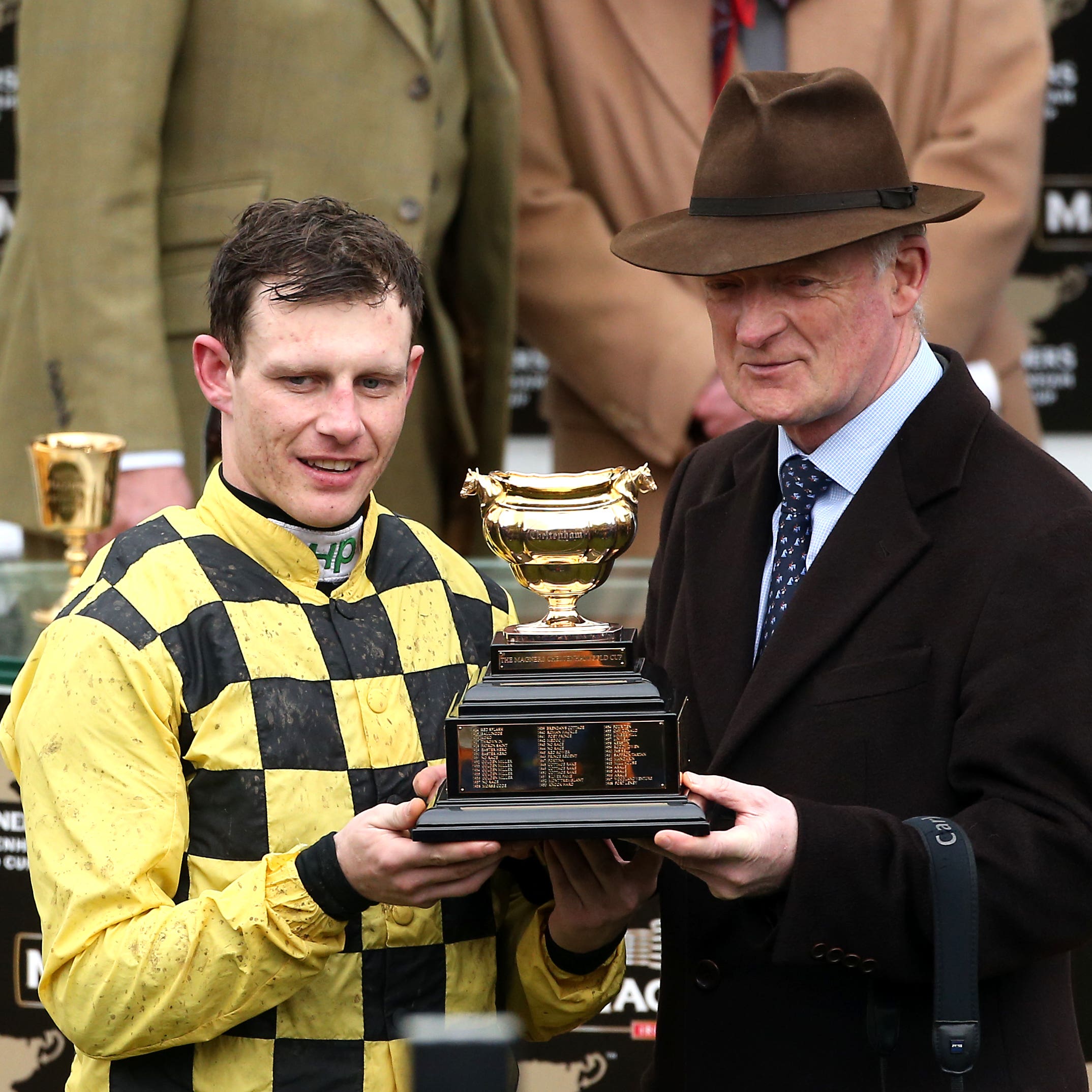 Jockey Paul Townend (left) and trainer Willie Mullins with the trophy after winning the Magners Cheltenham Gold Cup Chase with Al Boum Photo