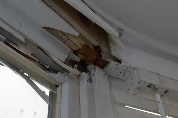 Damage to a window frame in a property near to the explosion