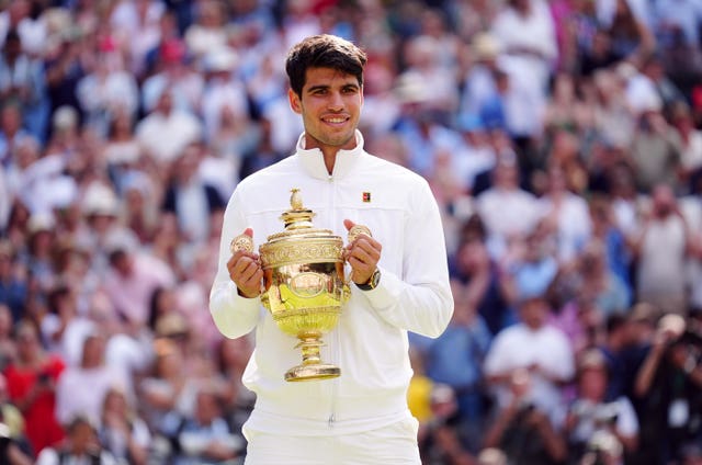 Carlos Alcaraz with the Wimbledon trophy