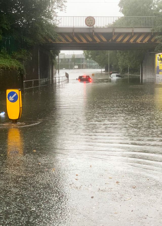 Vehicles stuck in water at Heaton Chapel in Stockport, Manchester 