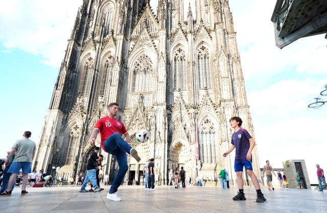 England fans playing football in front of Cologne Cathedral