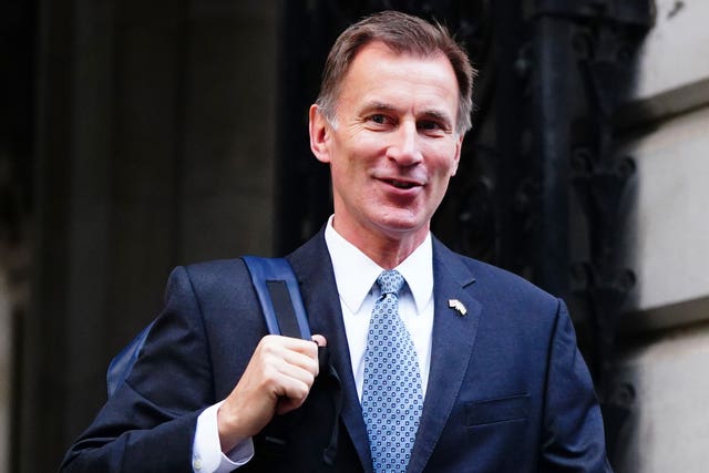 Chancellor Jeremy Hunt has been urged to increase child benefit payments and expand free school meals (Victoria Jones/PA)