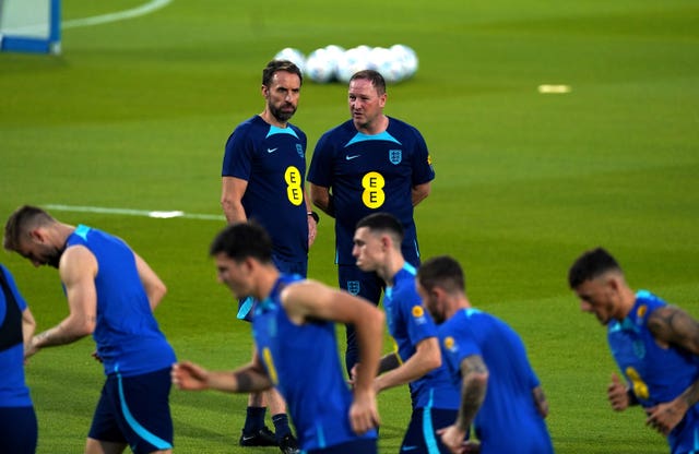 Gareth Southgate watches England's players during a training session 