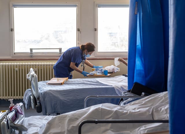 A nurse at work in a hospital ward