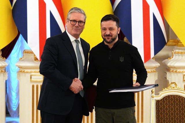 Prime Minister Keir Starmer (left) and Ukrainian President Volodymyr Zelensky shake hands