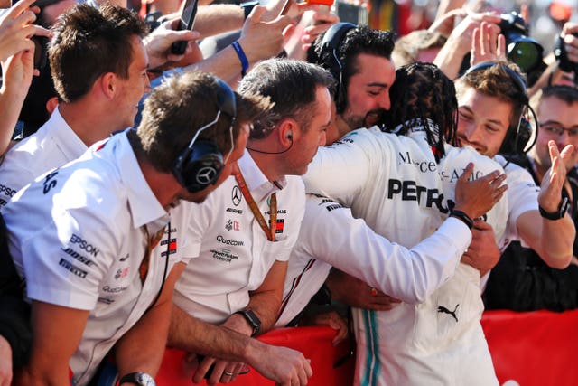 Hamilton celebrates with his Mercedes team in Texas