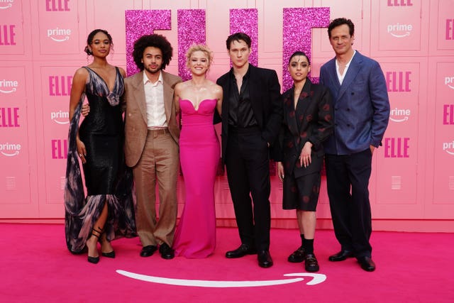 The cast of Elle on a special pink carpet