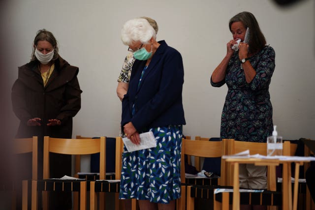 People attend a service at St Thomas' Church in Plymouth, Devon, where five people were killed by gunman Jake Davison in a firearms incident on Thursday evening 