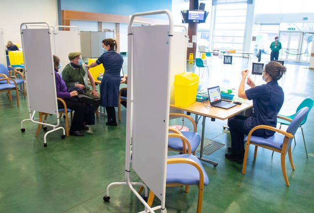 Patients receiving the Oxford/AstraZeneca Covid-19 vaccine at the NHS vaccine centre that has been set up in the grounds of the horse racing course at Epsom in Surrey