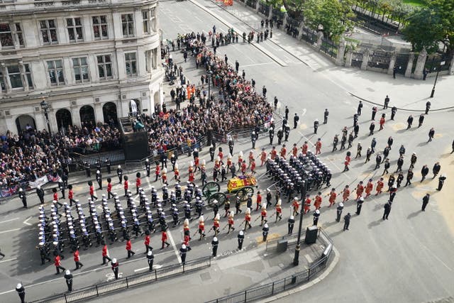 The State Gun Carriage carries the Queen's coffin after her state funeral at Westminster Abbey