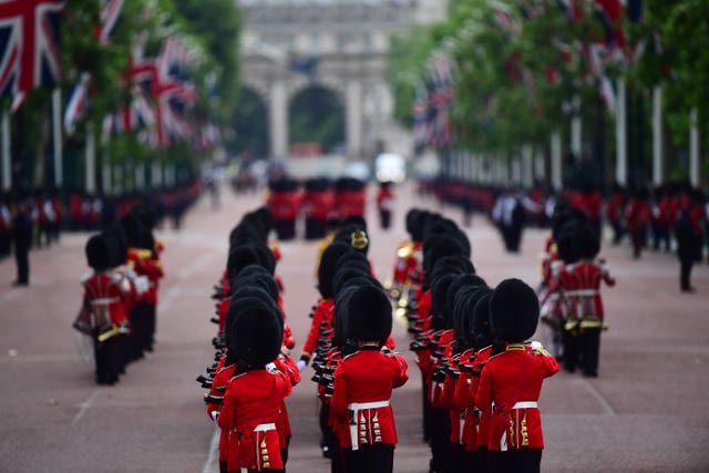 Soldiers makes their way from Buckingham Palace to Horse Guards Parade ahead of the ceremony 