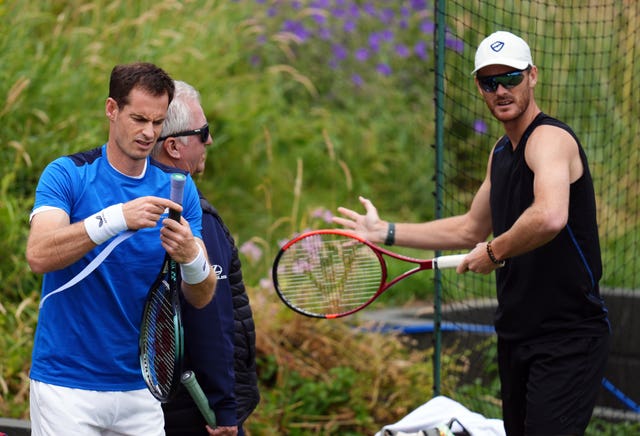 Andy Murray and Jamie Murray prepare for a practice session 