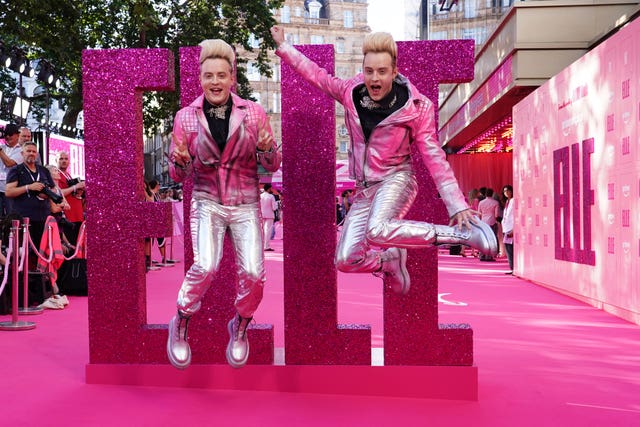 Jedward do their thing on the pink carpet