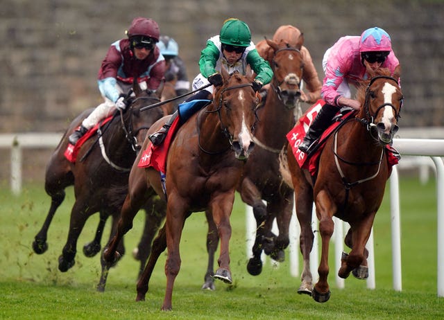 Live In The Dream ridden by jockey Ryan Moore (right) on their way to winning at Chester