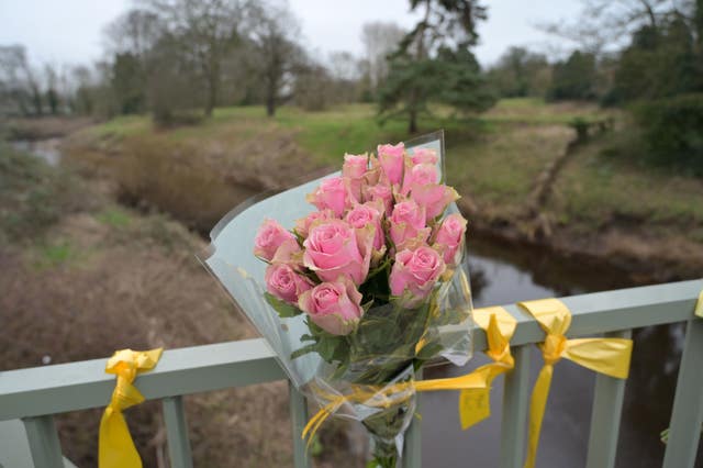 Flowers and ribbons on a bridge over the River Wyre 