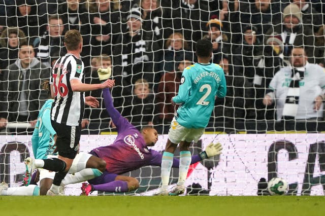 Sean Longstaff, left, scores his and Newcastle’s second goal