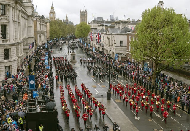 The Coronation Procession passes along Whitehall to Buckingham Palace