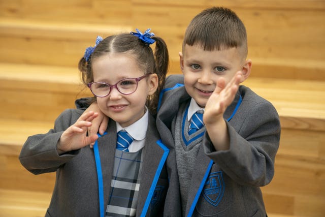 Eva-Grace and Greyson McNab embrace and wave