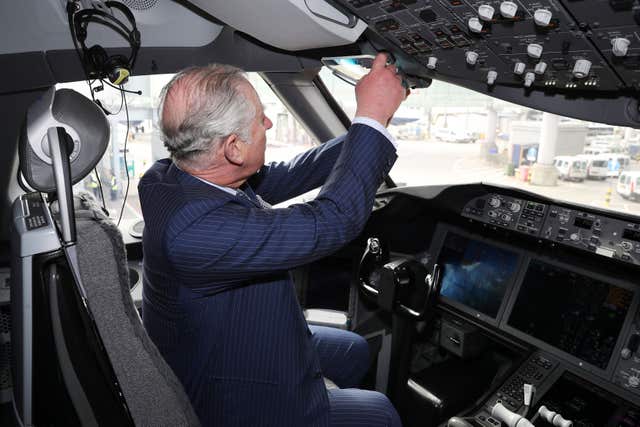 The Prince of Wales is shown the cockpit of a British Airways 787 aircraft during a visit to Heathrow (Chris Jackson/PA)