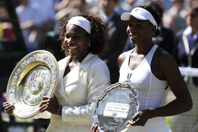 Serena Williams (left) celebrates her victory over sister Venus (Rebecca Naden/PA)