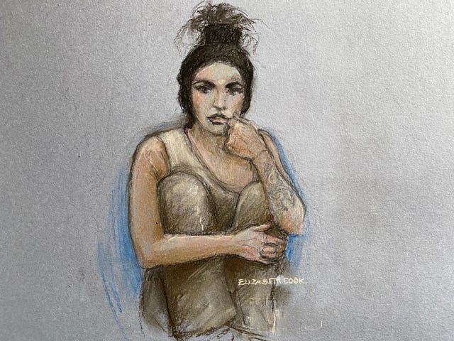 Court artist sketch of Katie Price sitting with her knees up while appearing by video link before a specialist bankruptcy judge 