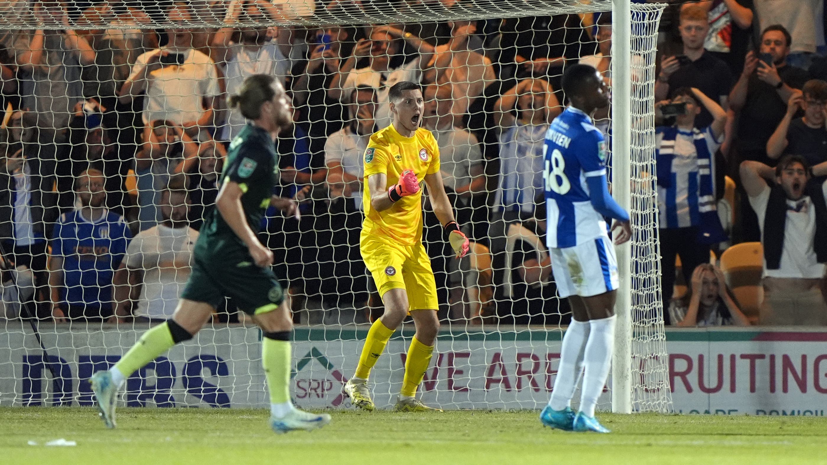 Brentford goalkeeper Hakon Valdimarsson (centre) reacts after saving a penalty (Joe Giddens/PA)