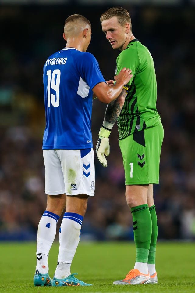 Everton goalkeeper Jordan Pickford, right, and team-mate Vitalii Mykolenko