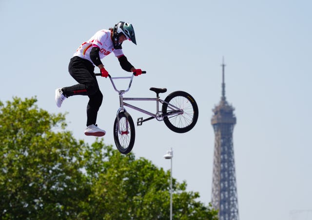 Sun Jiaqi with her bike in the air during women's park qualification