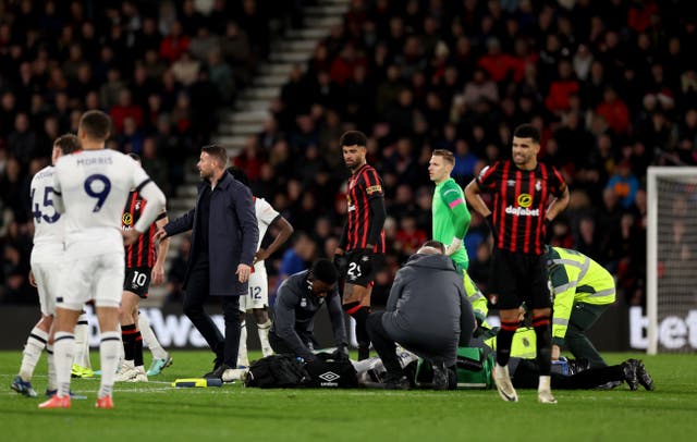 Luton's Tom Lockyer receives treatment on the pitch 