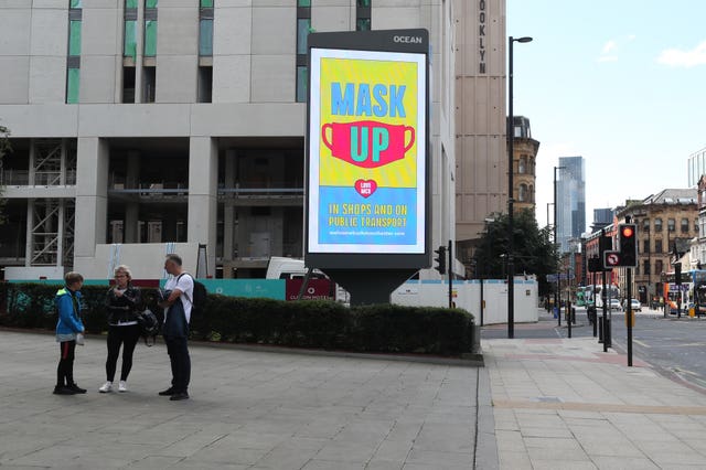 Advertising in Manchester promoting the wearing of masks (Peter Byrne/PA)