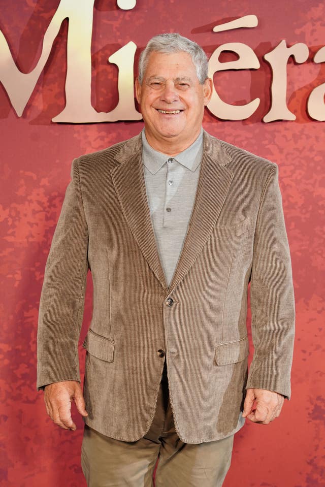 Sir Cameron Mackintosh smiling at the camera