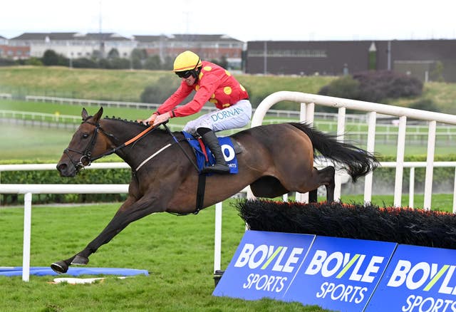 Winning Smut and jockey Jack Kennedy on their way to Galway glory