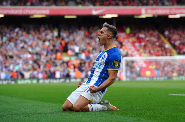 Brighton and Hove Albion’s Leandro Trossard celebrates scoring their side’s third goal of the game, completing his hat-trick, during the Premier League match at Anfield, Liverpool