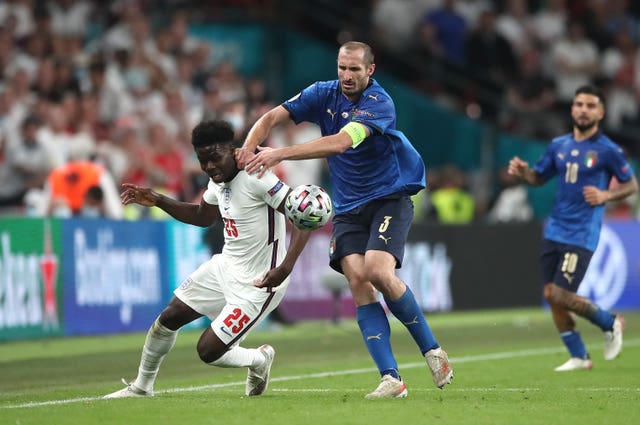 Italy’s Giorgio Chiellini pulls back Bukayo Saka during the Euro 2020 final 