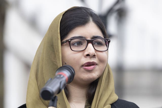 Malala Yousafzai speaking into a mic