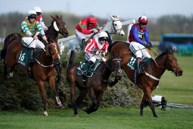 Famous Clermont (right) jumps the final fence at Aintree