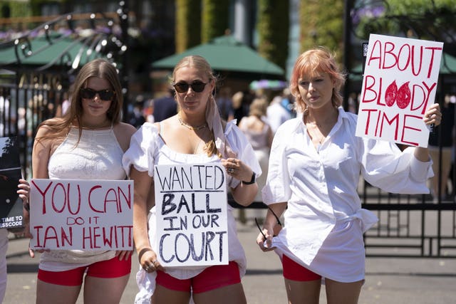 Campaigners from Address The Dress Code protest the all-white rule