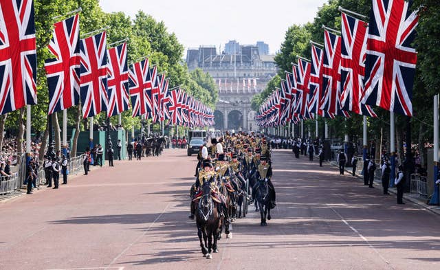 The Kings Troop of the Royal Horse Artillery ride down the Mall 