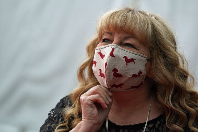 Janey Godley in a red and white face mask