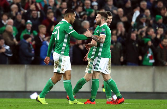 Josh Magennis (left) celebrates scoring Northern Ireland's second goal in a 2-1 win over Belarus