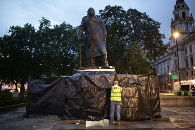 The Sir Winston Churchill statue being cleaned after it was uncovered (Yui Mok/PA)
