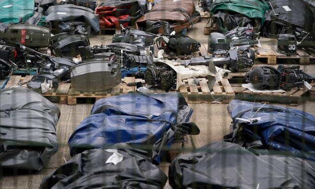 A view of small boats and engines used to cross the Channel by people thought to be migrants