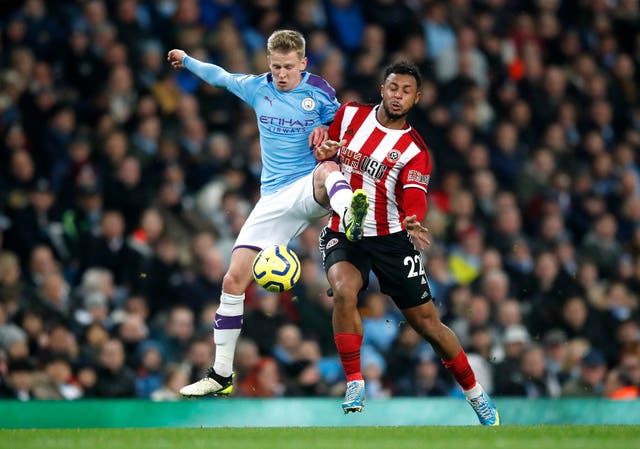 Oleksandr Zinchenko (left) in action against Sheffield United's Lys Mousset