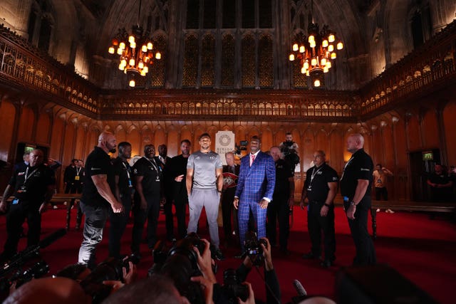 Anthony Joshua, left, and Daniel Dubois face off beneath chandeliers following a press conference at the Guildhall in London