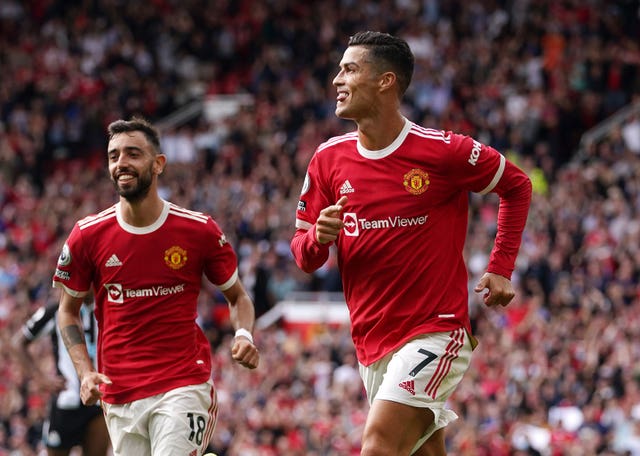 Cristiano Ronaldo, right, celebrates his first goal