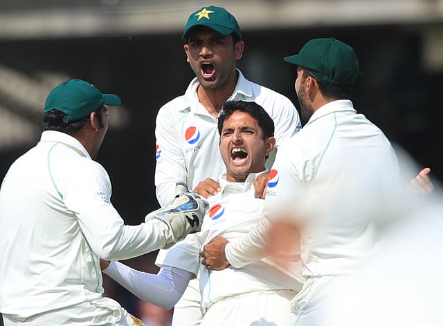 Mohammad Abbas celebrates taking the wicket of Joe Root 