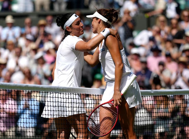 Ons Jabeur (left) hugs Tatjana Maria after beating her in the semi-final